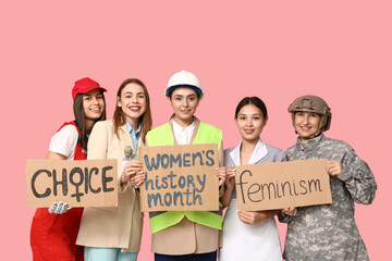 Sticker - Women of different professions holding cardboard pieces with different text on pink background. Women history month