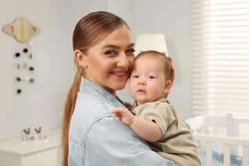 Poster - Mother holding her cute newborn baby at home