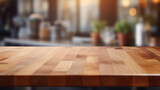 Fototapeta  - Empty wooden table top with a blurred cafe background, perfect for product display and mockups.
