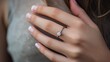 Close-up of a woman's hand wearing an engagement ring