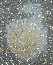 A Trace Of Gasoline On The Asphalt As A Background. Texture