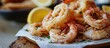 Fried calamari rings and shrimp, a popular seafood dish.