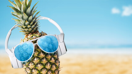 Wall Mural - Funny pineapple with headphones at the beach