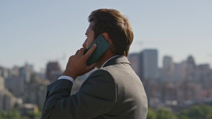 Wall Mural - Bearded executive speaking cellphone on street close up. Businessman calling