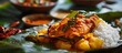 Traditional Indian fish curry made with tapioca and spicy Kerala-style seasoning, served on a banana leaf. Also known as kappa or cassava with sardine masala, this Asian cuisine dish features a