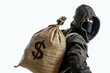 © Bussakon - Financial threat. Dangerous criminal in mask stealing cash robbery concept. Banking burglar. Finance activity with thief in black hood. Economic risk. Dark background with dollar bills money