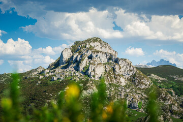 Wall Mural - Stunning landscape of Asturias, Spain with green mountains against a blue sky with white clouds