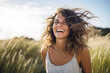 smiling woman laughing outdoors