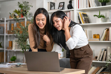 Wall Mural - Two female accountants have a team meeting to summarize financial information in the office