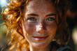 closeup portrait of smiling redhead girl with freckles in summer