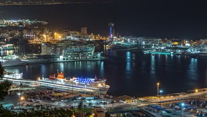 Wall Mural - Night Skyline Timelapse from Montjuic Overlooking Port Vell in Catalonia, Spain. Aerial Top View from Hill Captures the Glowing Cityscape, Illuminated Ship and Terminal, Creating a Mesmerizing Vista