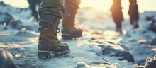 men s feet in boots in the snow walking in winter. with copy space image. Place for adding text or design