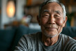 Happy asian elderly man in a living room