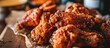 Junk food enthusiast indulging in fried chicken wings.
