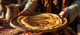 Fototapeta  - Hand holding a Moroccan pancake, baghrir, common in Moroccan breakfasts.