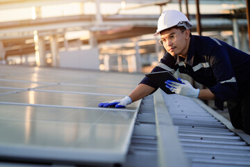 young engineer's hand inspecting the cleanliness of a solar panel. Concept: Renewable energy, clean technology, electric energy