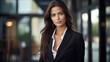 Beautiful brunette woman in stylish business clothes. Successful strong woman, office worker, manager.