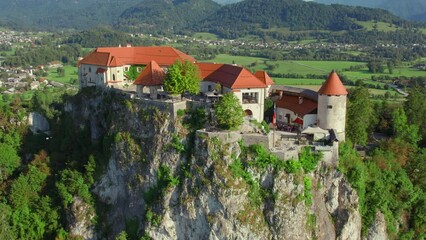 Wall Mural - Aerial view of the medieval Bled Castle on a high cliff at Lake Bled in Slovenia