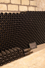 Poster - bottles of wine in  old cellar in center of Eger, Northern Hungary