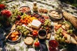 © PinkiePie - An overhead shot of a picnic blanket spread with delicious food on a sunny meadow