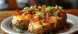 Loaded potato with bacon, cheese, and scallions