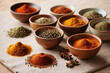 Spices and Herbs on a wooden table, different seasonings in cups. Spice background on the table.