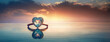 An engagement ring with a heart-shaped diamond gem sits atop the serene waters at sunset, symbol of love, romantic proposal on Valentine's day. Panorama with copy space.
