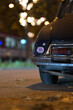 Black french classic car parked in front of other cars at night in Duesseldorf, Germany
