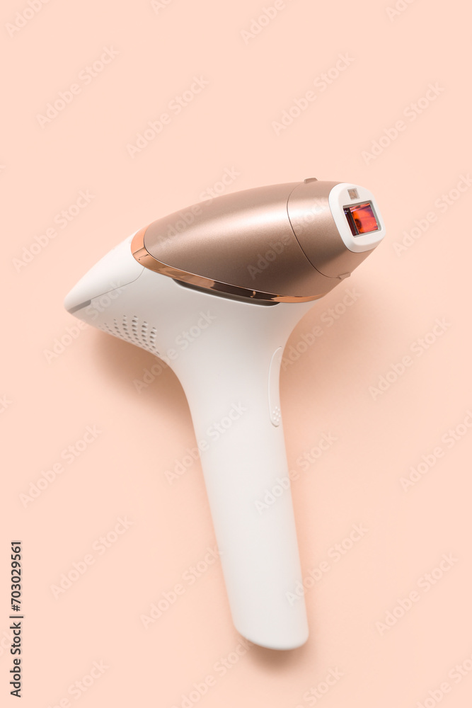 Modern photoepilator against color background
