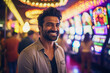 © Bougie Banana - Happy Indian man at casino slot machines enjoying nightlife lifestyle