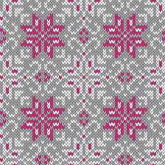 Wall Mural - Knitted winter seamless pattern. Grey white and pink background. Vector illustration.