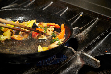 Wall Mural - frying pan with meat and vegetables