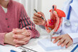 © NanSan - female medical professional with a stethoscope is holding a clipboard, possibly discussing gastritis or other stomach diseases with a patient.