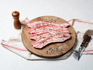 Canvas Print - Raw meat and spices on wooden board	