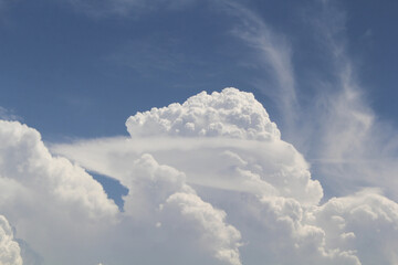 Fluffy white clouds in a blue sky