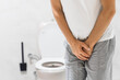 © ATRPhoto - Person with urinary problems, Medical problem urinary incontinence. people with crotch pain, Man with hands on crotch with urinary problems