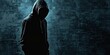 Shrouded in darkness. Unrecognizable criminal figure in hooded silhouette. Faceless threat. Mysterious man in shadows symbol of urban menace. Anonymous and dangerous unseen face of crime