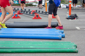 A view of athletes participating in obstacle course challenges.