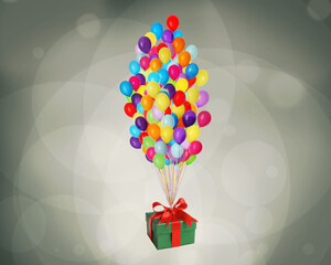 Many balloons tied to gift box on color background