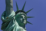 Fototapeta Nowy Jork - The Statue of Liberty with its crown is the democratic symbol of New York (USA) and the Big Apple, famous in Manhattan and around the world.
