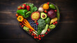 heart shape by various vegetables and fruits on black stone background