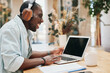 © SHOTPRIME STUDIO - Technology man office business online laptop computer headset businessman earphones young person
