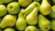  a pile of green pears and pears with one pear cut in half and one pear in the middle.