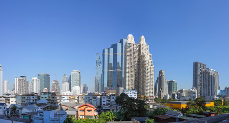 Wall Mural - Panoramic city skyline of Bangkok with slums on the foreground. Contrasts of a rapidly developing city and country economy