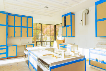 Wall Mural - Assembling of white kitchen cabinets in home improvement project