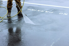 Street Is Sprayed With Pressurized Water To Be Cleaned, Road Is Washed By Water