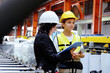© krongthip - Engineers and employees check product stocks in industrial plants.