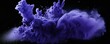Explosion of periwinkle colored powder on black background 