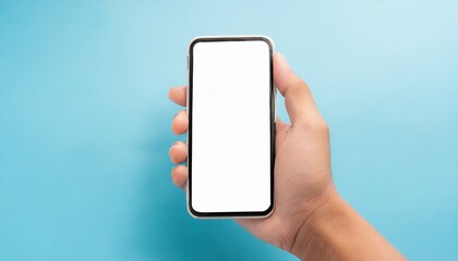 Hand using smartphone with blank screen, isolated on blue background