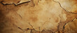 Old vintage paper texture background, brown ancient sheet parchment with torn edges. Top view of dirty rough worn paper. Theme of antique, recycle, grunge, art, wrapping, kraft